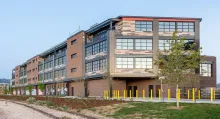 The Railyards at S'PARK office building in Boulder, Colorado, beside the railroad tracks.