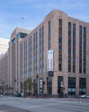 The former Twitter headquarters building in San Francisco, with the Twitter sign on its corner.