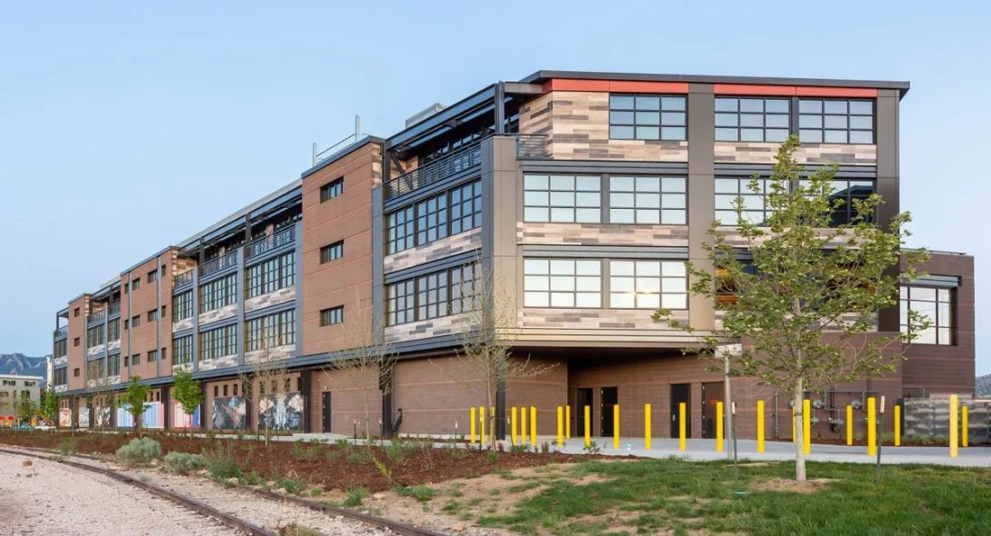 The Railyards at S'PARK office building in Boulder, Colorado, beside the railroad tracks.