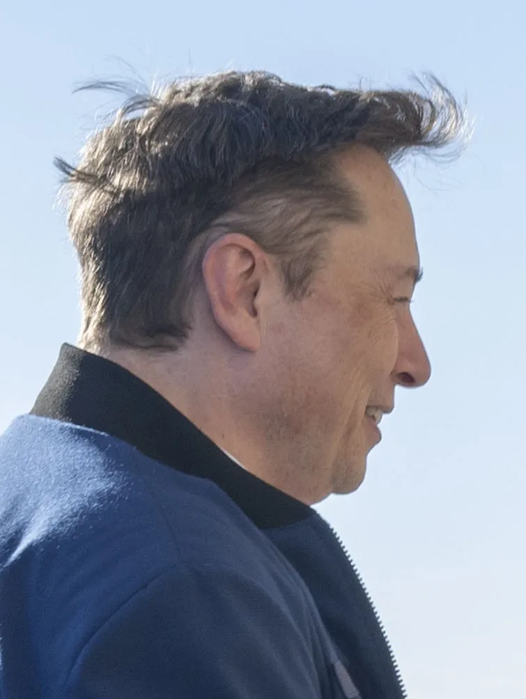 A photograph of Elon Musk, who spotlighted Grok Bot's new Vault, Pages and video features on X.